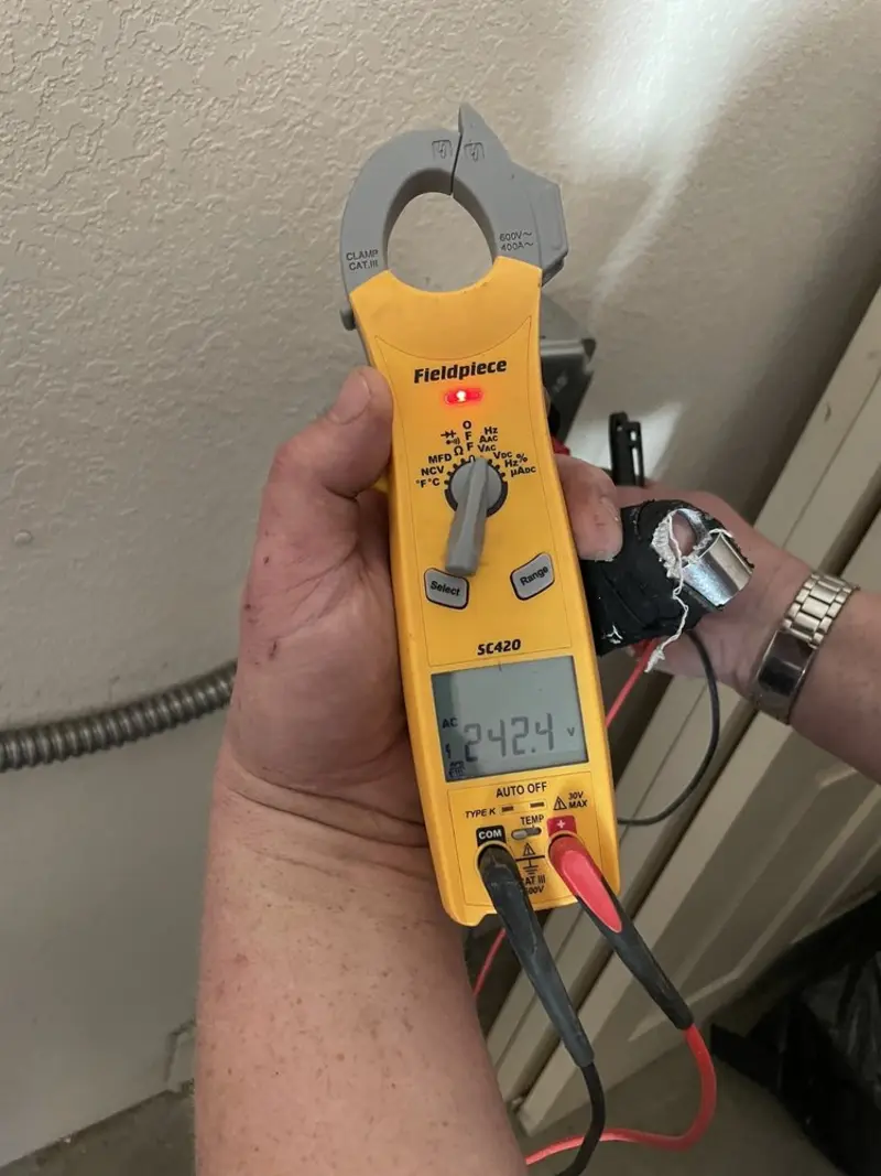 Voltage testing with clamp meter during Outlet Installation in Hampton